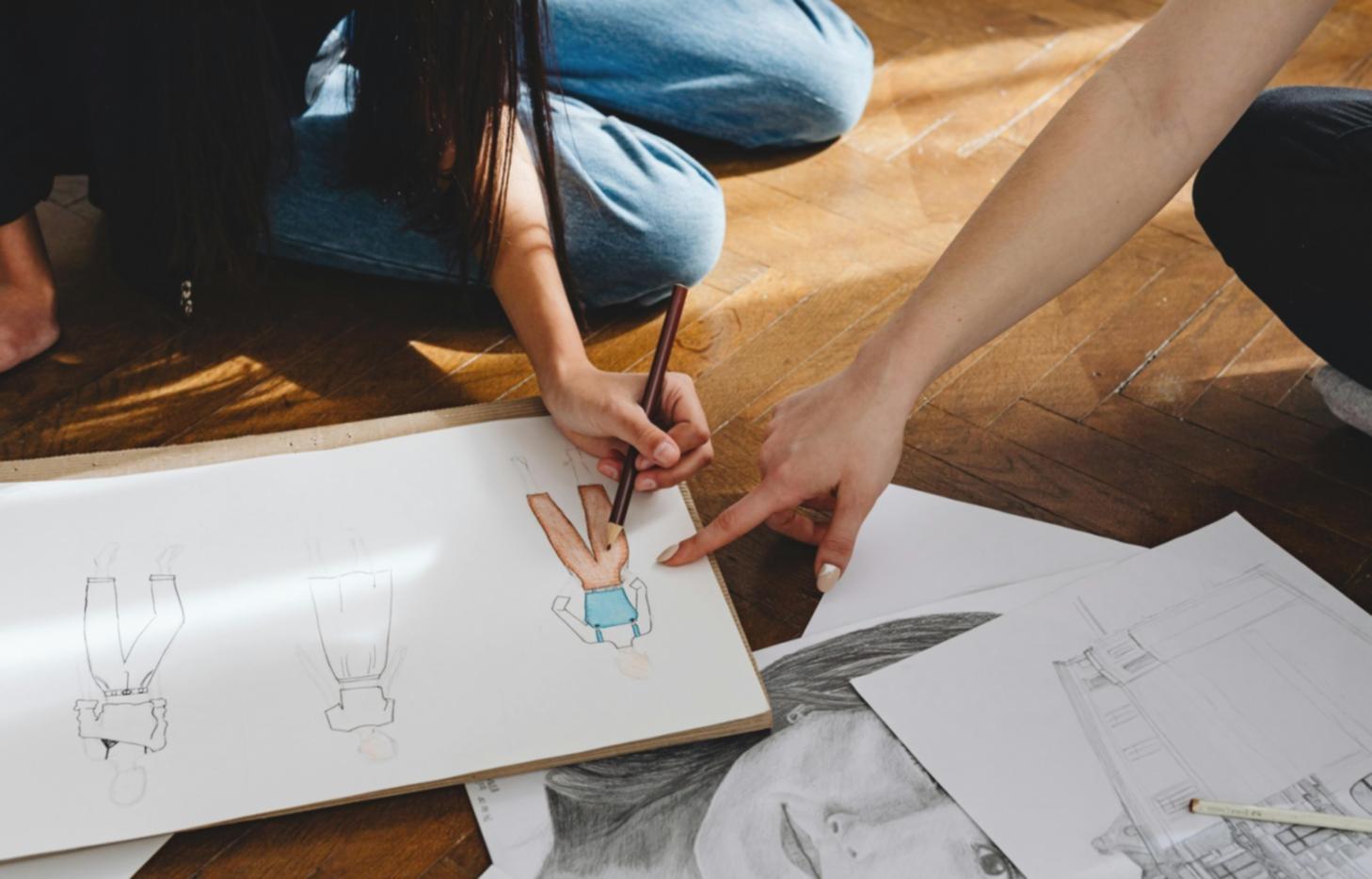 Instructor demonstrating measurement techniques on portrait reference