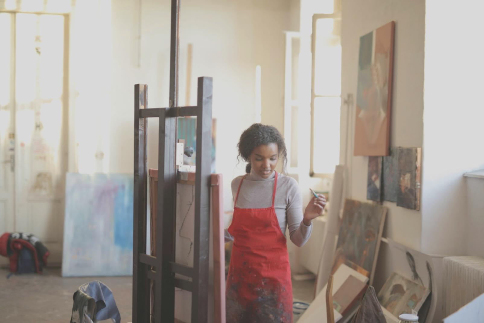 Instructor demonstrating shading technique during portrait drawing lesson